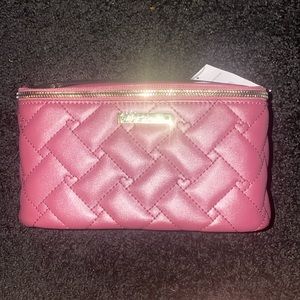 Brand new Betsey Johnson 3 piece nested top set cosmetic case. Maroon color